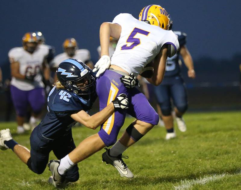 Mendota's Wyatt Ossman tries to escape the tackle by Bureau Valley's Drake Hardy on Friday, Sept. 22, 2023 at Bureau Valley High School.