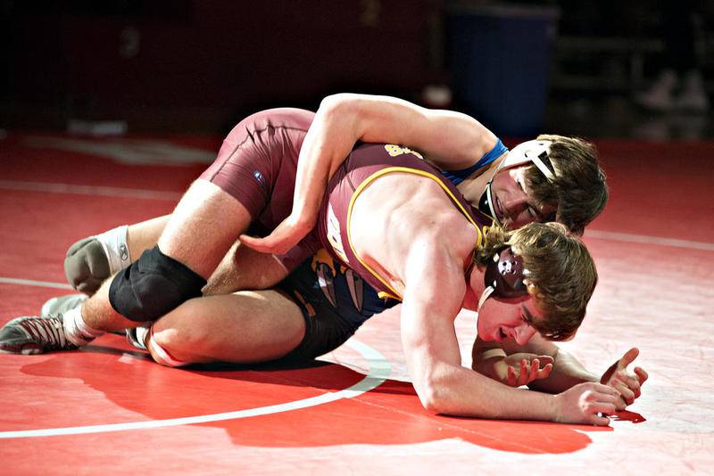 Richmond-Burton's Dalton Wood and Johnsburg's Justin Peake (in blue) square off in the 182-pounds final match Saturday at the Class 1A Oregon Sectional in Oregon.