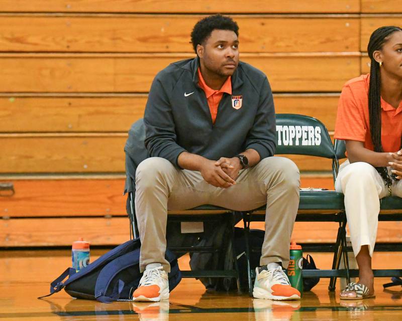 Oak Park River-Forest's Head Coach Justin Cousin looks on during the game on Tuesday April 16, 2024, while traveling to take on Glenbard West High School.