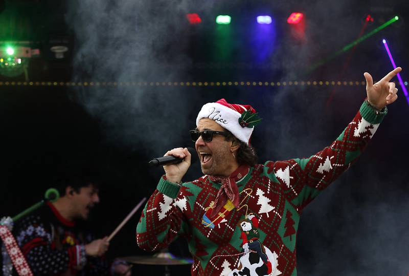 Zac Barnett of American Authors sings a song during a stop in Pingree Grove on Wednesday Nov. 27, 2024, by the Canadian Pacific Kansas City Railway 2024 Holiday Train. The holiday train raised food and monetary donations for the D300 Food Pantry during its stop in Pingree Grove.