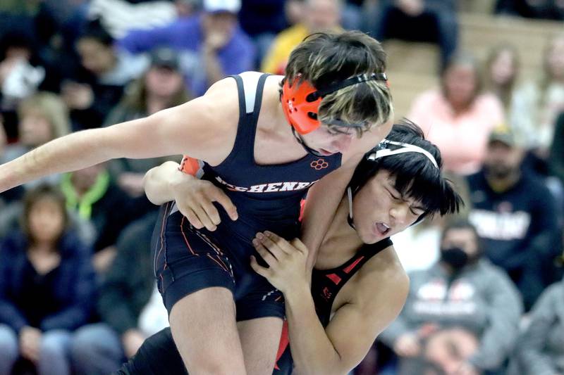 Huntley’s Rafael Sobrepena (right) battles McHenry’s Ryan Nagel at 138 pounds in their Fox Valley Conference dual on Friday in Huntley.