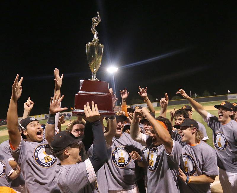 Members of the Illinois Valley Pistol Shrimp baseball team hoist the Prospect League trophy after winning the Prospect League Championship against Rex on Wednesday, Aug. 7, 2024 at Schweickert Stadium in Peru.