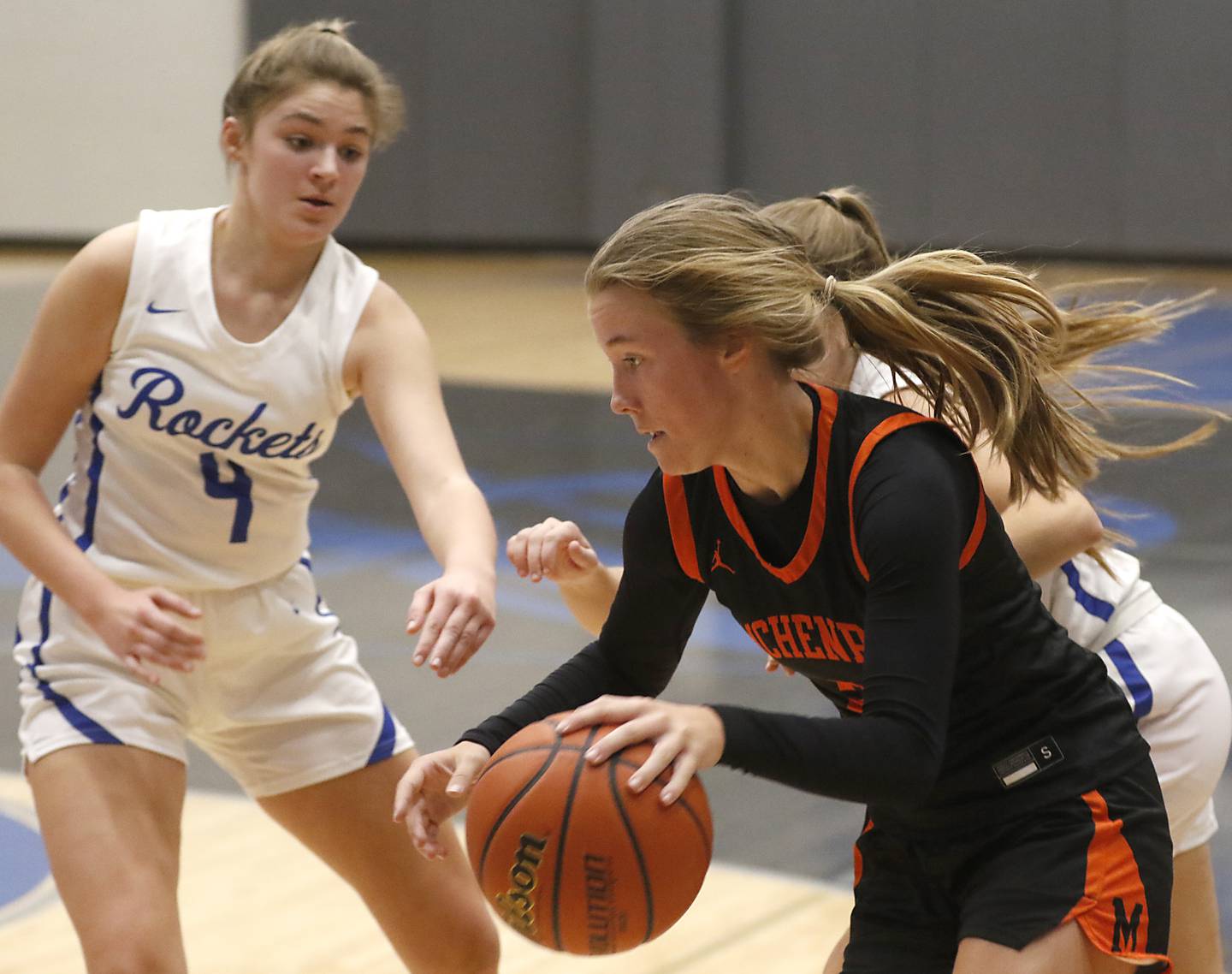 McHenry's Emerson Gasmann drives the baseline agains Burlington Central's Emersyn Fry (left) and Haley Lindquist during a Fox Valley Conference girls basketball game Wednesday, Jan. 4, 2023, at Central High School in Burlington.