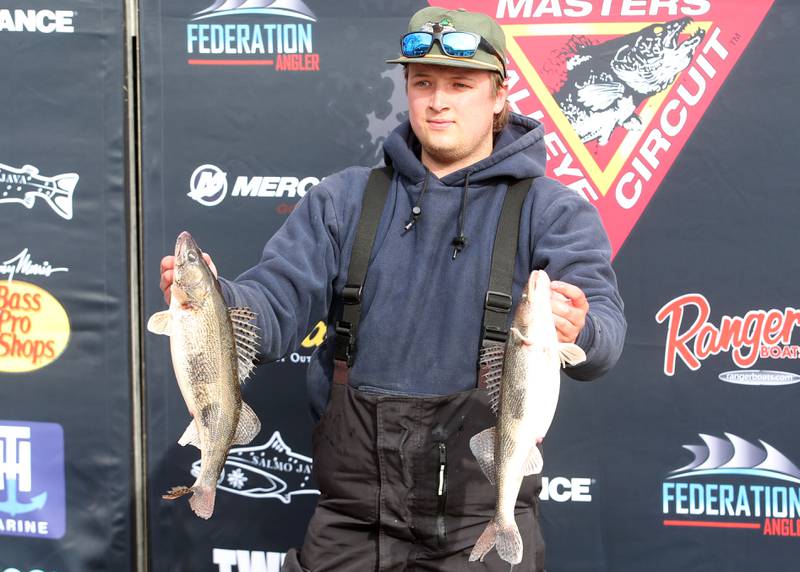 Drake Doucette of Bureau, holds his walleye that he caught during the annual Masters Walleye Circuit tournament on Friday, March 21, 2025 at the Spring Valley Boat Club.