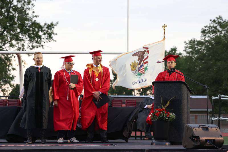Student speaker Jostin Ramirez, right, shares his story during the Bradley-Bourbonnais Community High School commencement ceremony on Thursday, May 21, 2026. Fellow student speakers Calvin Kohl, secoond from right, and Derek Otero listen next to Principal Evan Tingley, left.