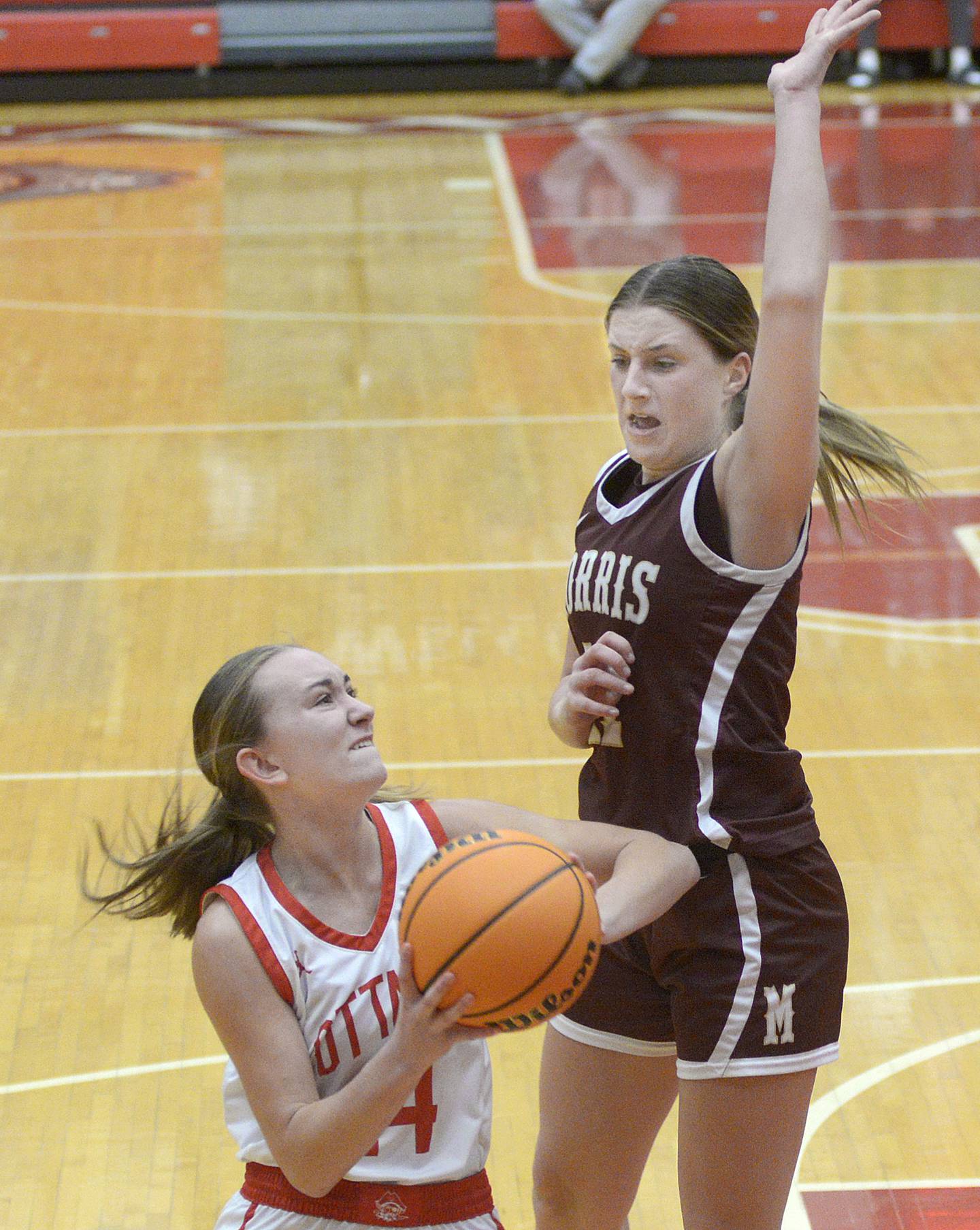 Ottawa’s Ashlynn Ganiere tries get a shot past the block of Morris’s Alyssa Jepson in the first quarter of Saturday's championship game of the Ottawa Holiday Tournament.