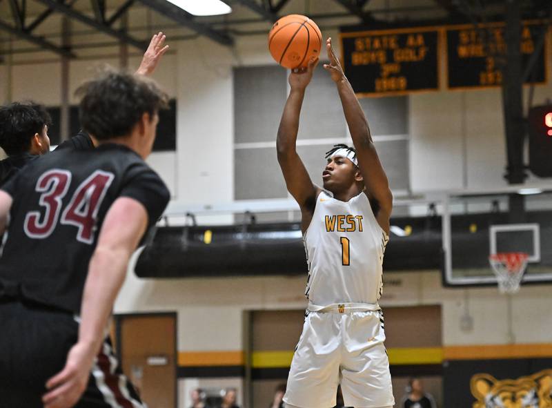 Joliet West's Mickeis Johnson (1) shoots a jump shot during a conference game against Plainfield North's on Friday, Dec. 20, 2024, at Joliet.