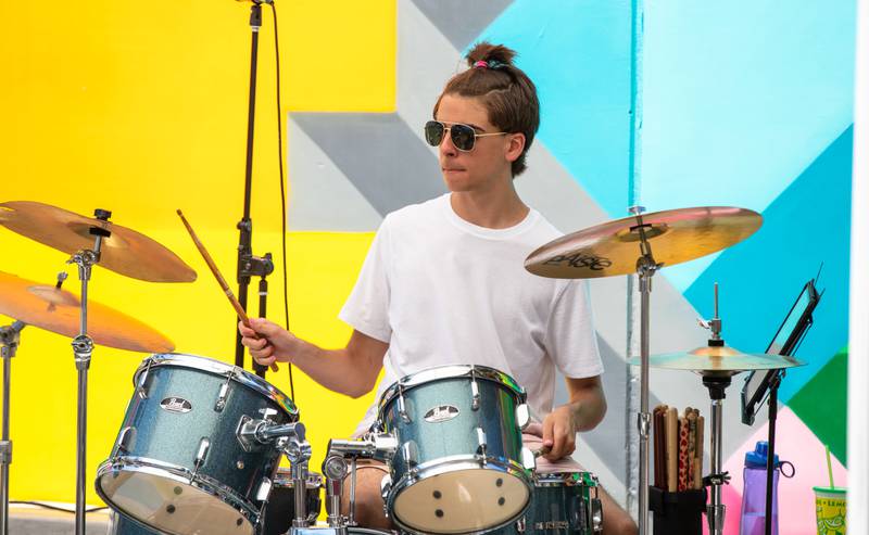 Drummer Lucas Turner performs with the band Double Helix during Make Music Wheaton and the Wheaton French Market in The Wheaton French Market Plaza on Saturday, June 21, 2025.