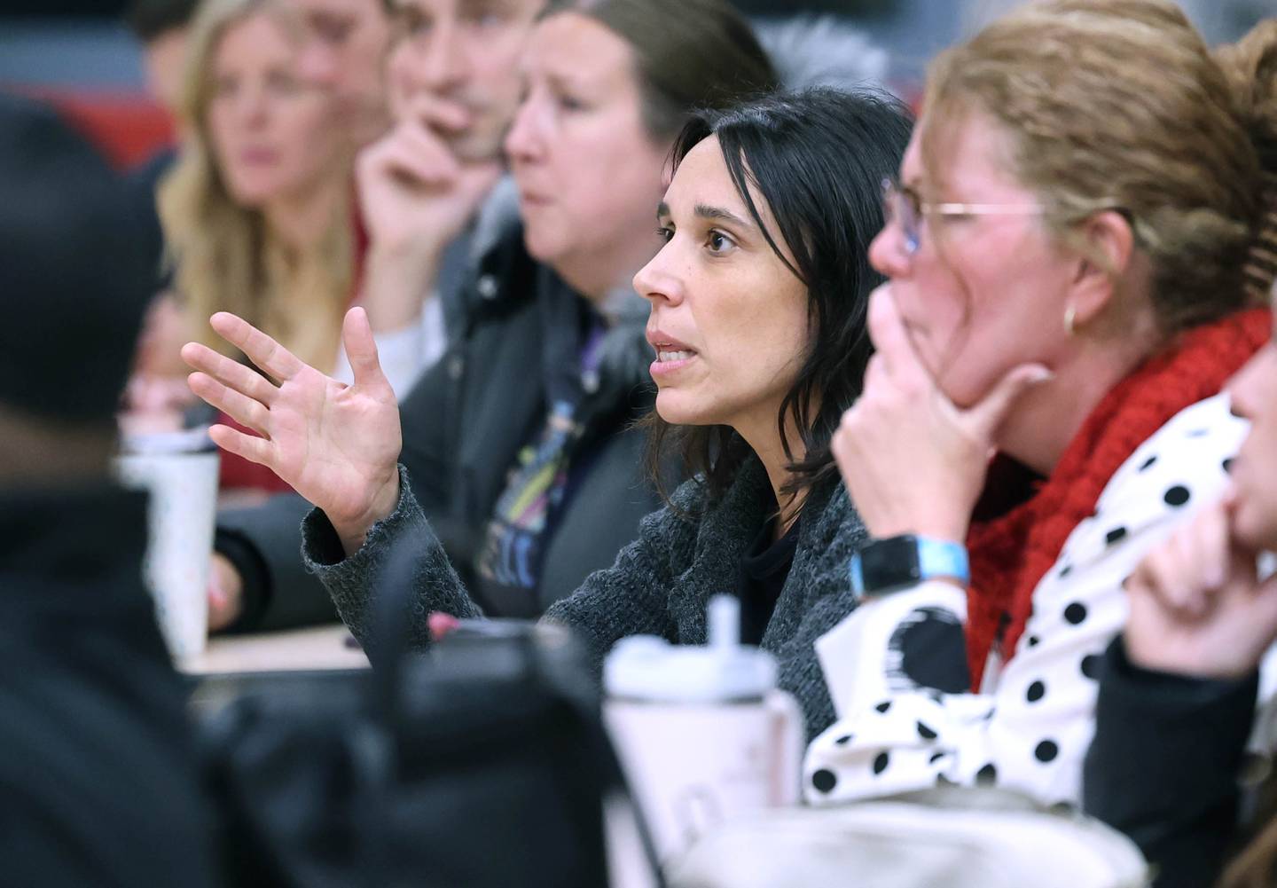 Mary Fischer, a parent of a student in Sycamore Community School District 427 asks a question of district superintendent Steve Wilder Monday, Jan. 9, 2023, during a public meeting hosted by the district at North Grove Elementary School. The forum was held to get staff and community feedback on a plan that could change the district boundaries causing some students to have to switch elementary schools inside the district as early as next year.