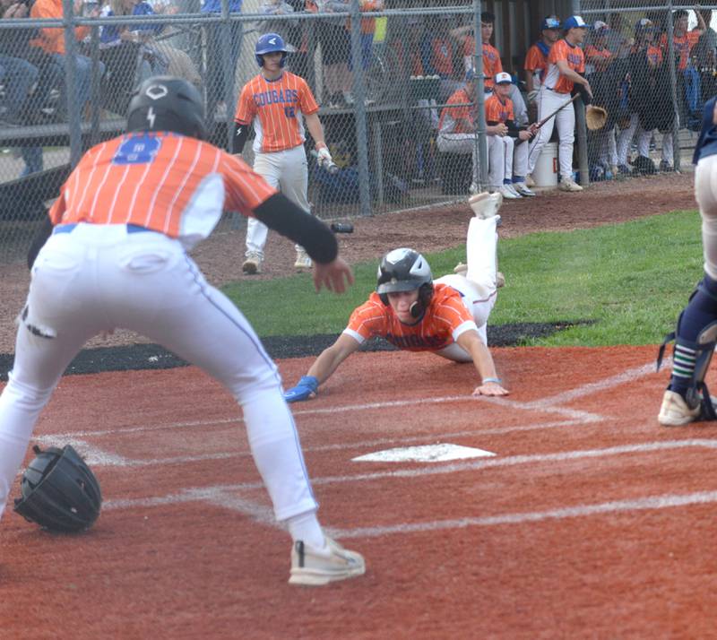 Eastland's Tanner Stern slides in to home against River Ridge/Scales Mound at the 1A Lena-Winslow Sectional on Wednesday, May 28, 2025. The Cougars lost the game 5-4.