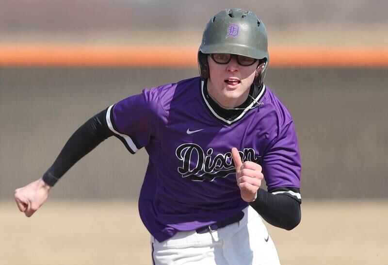 Dixon's James Leslie hustles to third during their game against DeKalb Tuesday, March 28, 2023, at DeKalb High School.