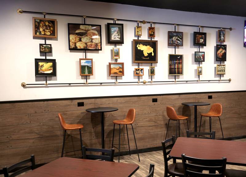 A wall of photos from Venezuela at the recently opened Provecho Home Made Food Friday, May 22, 2026, at 131 East Lincoln Highway, in DeKalb.