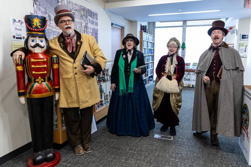 The Merry Maskers perform inside the White Oak Library District’s Lockport Branch during Lockport’s Christmas in the Square festivities on Nov. 29, 2025.