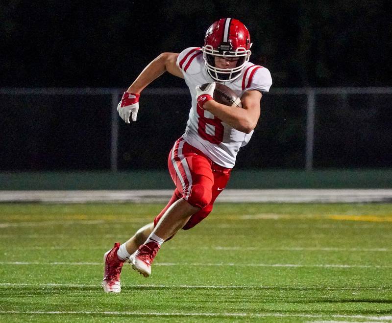 Yorkville's Ryan Wulff (8) carries the ball against Plainfield Central during a football game at Plainfield Central High School on Friday, Sept. 15, 2023.