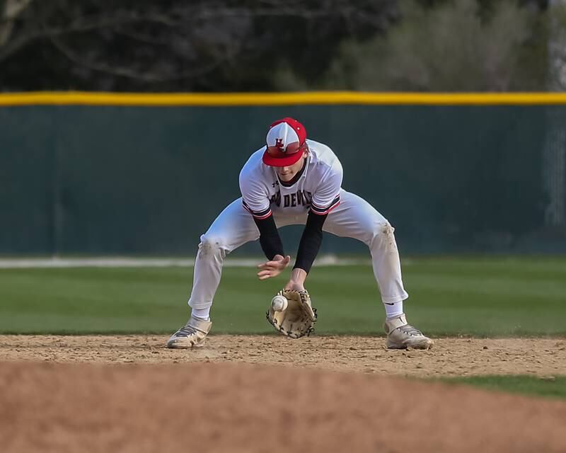 Hinsdale Central's Ben Oosterbaan (2) fields a grounder to short during baseball game between Lyons at Hinsdale Central. April 19, 2022.