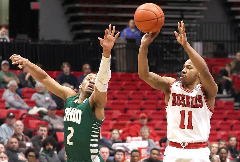 Northern Illinois Huskies guard David Coit shoots over Ohio Bobcats guard Miles Brown during their game Tuesday, Feb. 7, 2023, in the Convocation Center at NIU in DeKalb.