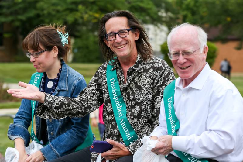 Glenbard West Distinguished Alumni, Molly Worthen, Ralph Covert, and Brian Spears ride in the Glenbard West Homecoming Parade.  Sept 16, 2023