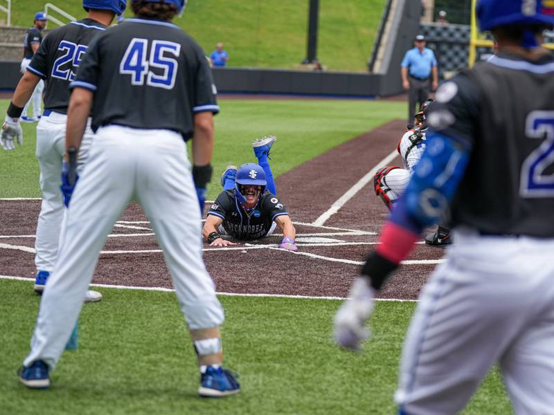 Prairie Ridge graduate Dom Listi slides in safe for Indian State in a game this season. Listi is tranferring to Clemson for his final college season.