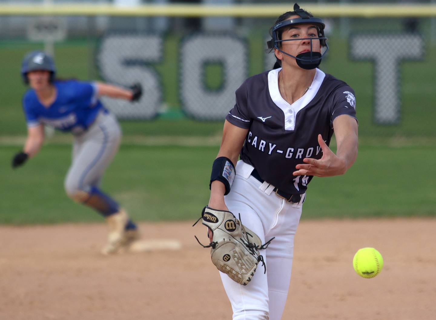 Cary-Grove’s Addy Green delivers against Burlington Central in varsity softball at Cary Monday.