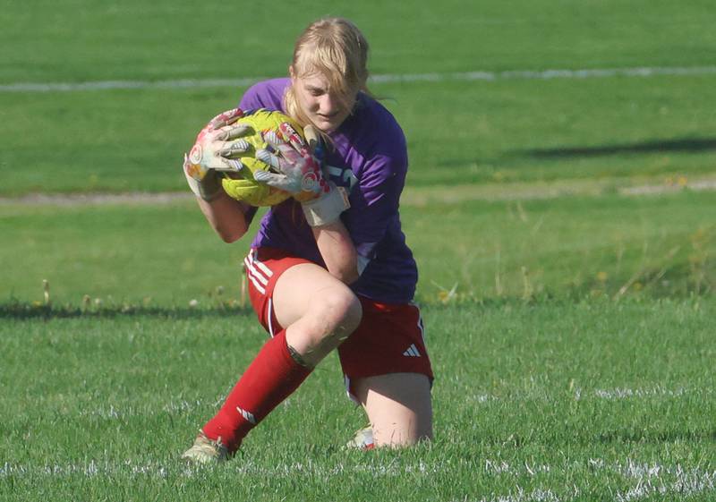 Streator keeper Olivia Brandenburg makes a stop in the box on Thursday, April 16, 2026 at the James Street Recreational Complex in Streator.