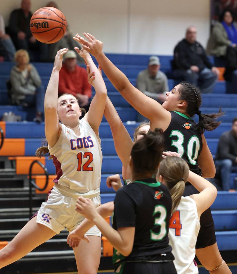 Genoa-Kingston's Ally Poegel and Rock Falls' Taylor Reyna go after a rebound during their game Friday, Feb. 2, 2024, at Genoa-Kingston High School.