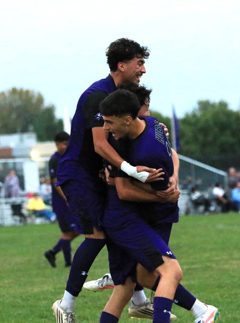 Rochelle players celebrate a goal during their game with Ottawa.