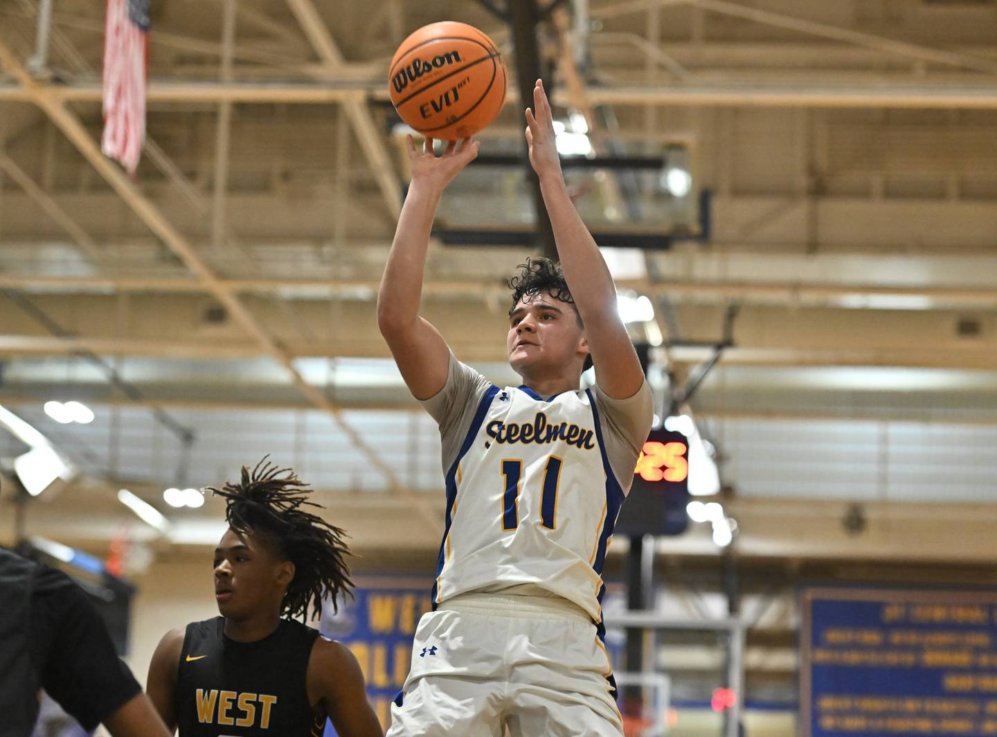Joliet Central's Tommy Jemilo (11) pulls up for a jump shot during a conference game against Joliet West on Thursday, Jan. 30, 2025, at Joliet.