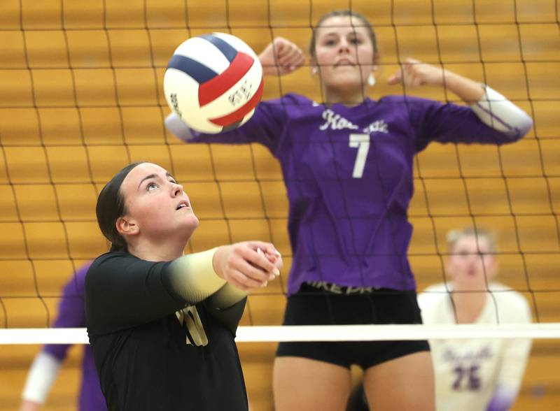 Sycamore's Sophia Lichthardt bumps the ball as Rochelle's Meredith Bruns looks on Tuesday, Oct. 28, 2025, during their Class 3A regional semifinal match at Rochelle High School.