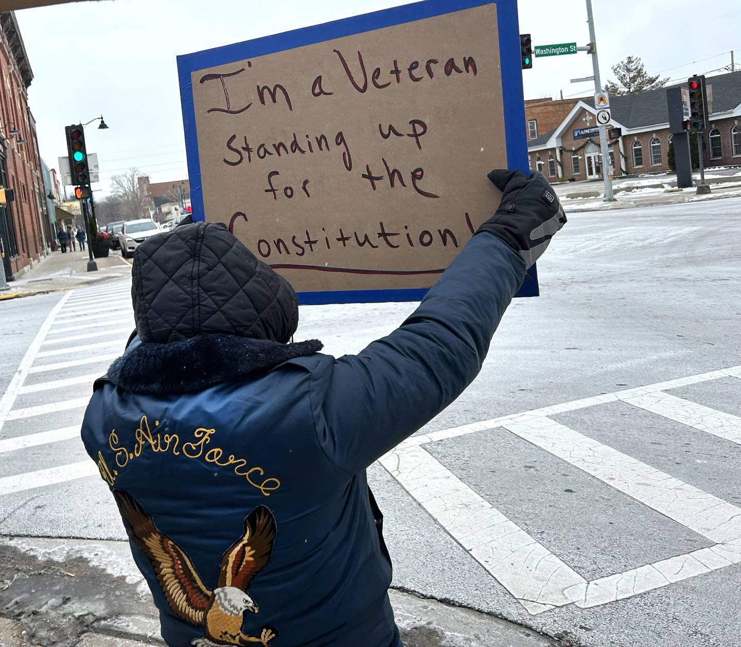 A veteran holds her sign during a Sunday, Jan. 25, 2026, protest against ICE and the Trump administration. The protest was organized by Indivisible of Ogle County and held despite temperatures in the single digits and wind chills nearing -7 degrees.