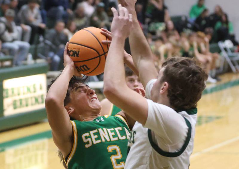 Seneca's Jesus Govea eyes the hoop over St. Bede's Gino Ferrari on Tuesday, Dec. 16, 2025 at St. Bede Academy.