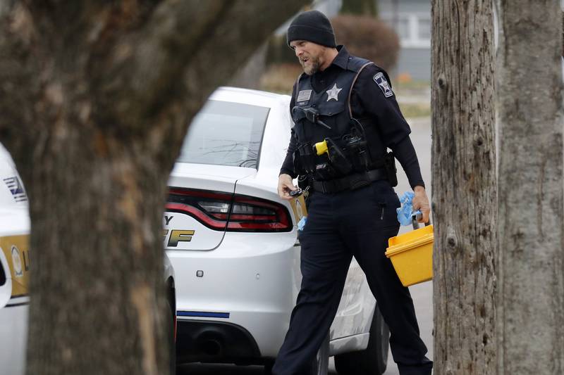 Police investigate at the residence of 408 La Fox River Drive on Wednesday, Dec. 1, 2021, in Algonquin. The bodies of a man and a woman were found about noon Wednesday after a well-being check on La Fox River Drive the day before, according to Algonquin police.