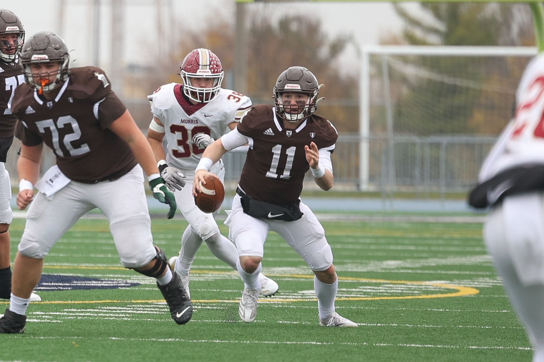 Joliet Catholic’s Lucas Simulick scrambles out of the pocket against Morris.