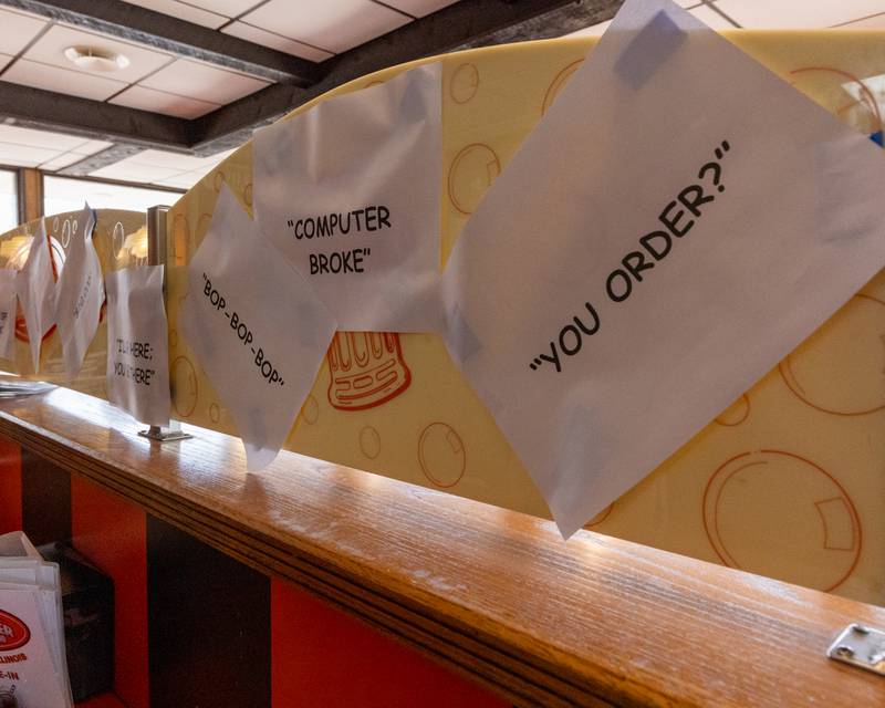 Signs with popular phrases Sam was known for saying hang at Sam’s retirement celebration on Saturday, October 25, 2025 at the Rootbeer Stand in Oglesby.