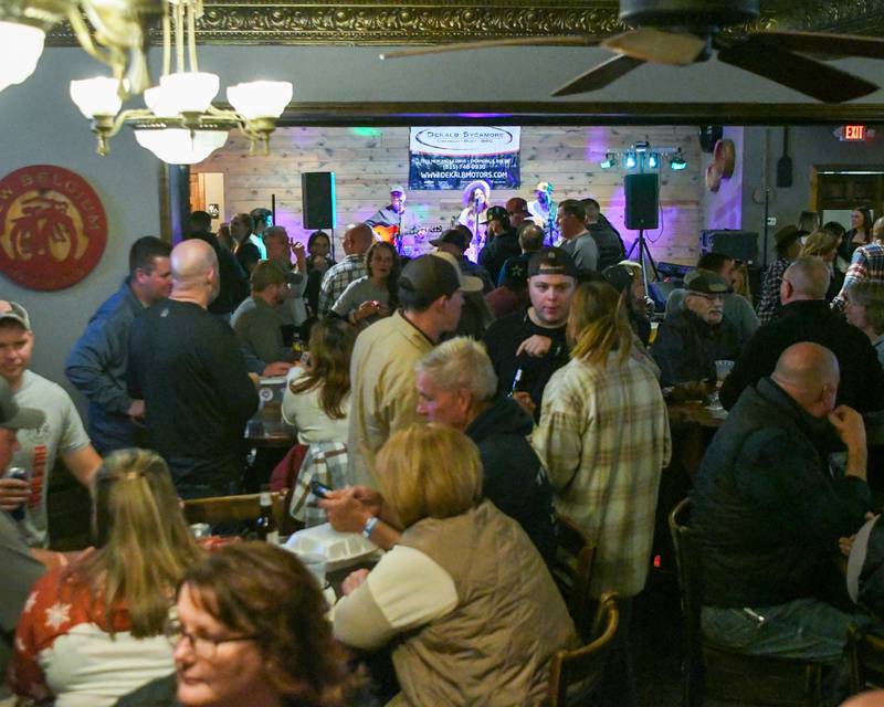 A packed crowd fills the bar area on Wednesday, Nov. 27, 2024, at Fatty's Pub and Grille in DeKalb during the DeKalb Fire Fighters Local 1236 union's Tip A Firefighter event to fundraise for the Muscular Dystrophy Association.