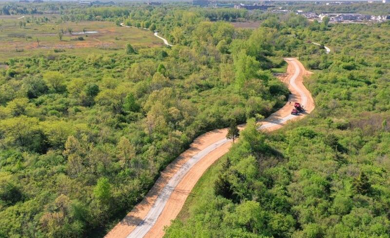 A new limestone path connects the Stonehedge subdivision in Wheaton with the scenic Danada-Herrick Lake Regional Trail. (Courtesy of the Forest Preserve District of DuPage County)