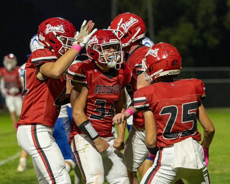 Aiden Redcliff (34) of Hall celebrates with teammates after scoring touchdown in first quarter of game against Princeton on Friday, Oct. 3, 2025 at Richard Nesti Stadium in Spring Valley.