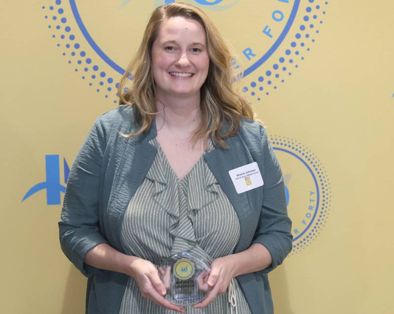 Maranda Johnson poses with her 40 Under Forty award during the Illinois Valley Chamber of Commerce Champions of Change Awards Night on Wednesday, May 6, 2026 at the Westclox Event Center in Peru.