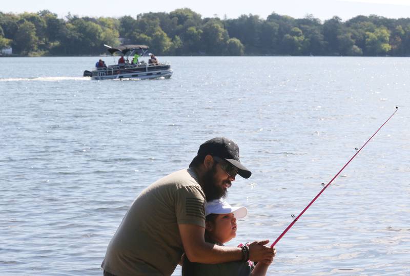 Jon Arroyo, of Round Lake Park teaches his daughter, Kayleigh, 6, how to fish during the Family Fishing Event at Lake Front Park on Saturday, September 9th in Round Lake Beach. The event was sponsored by the Round Lake Area Park District and the Huebner Fishery Management Foundation.
Photo by Candace H. Johnson for Shaw Local News Network