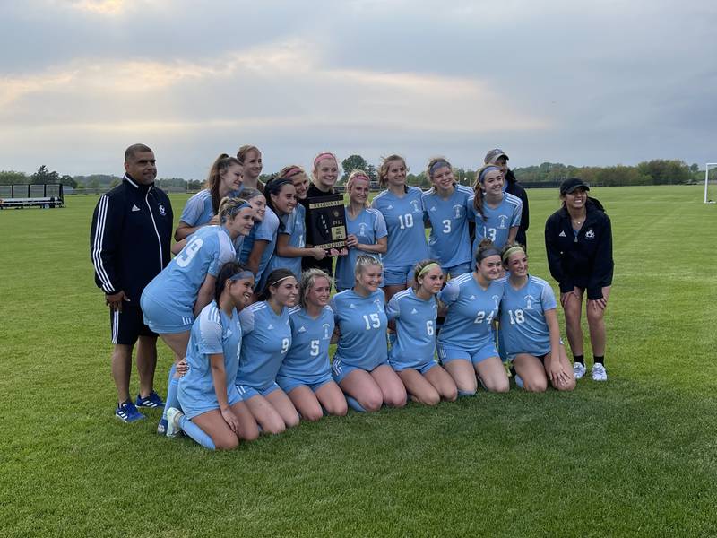 Joliet Catholic Academy posing with the Class 2A Kaneland regional plaque after their 3-1 victory over Kaneland on Friday.