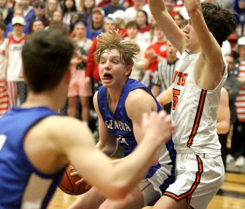 Geneva’s Tanner Dixon looks for an opening during a game at Wheaton Warrenville South on Friday, Jan. 27, 2023.