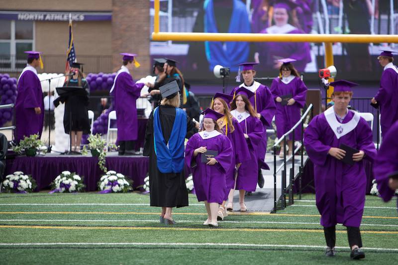 Downers Grove North graduates are congratulated by Principal Dr. Courtney DeMent at the Commencement Ceremony on Sunday, May 18, 2025 in Downers Grove.