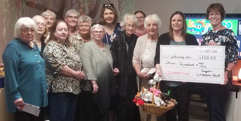 Oregon Woman's Club members (front row, left to right); Nancy Bartels, Jan Larson, Sharon Lung, Fran Strouse, Barb Semsel, Shining Star executive director Jessica Cash, Oregon Woman's Club president Jan Steward (middle row) osemary Underwood, Linda Arnold (back row) Audrey Taylor, Sandie Chasm, Johanna Hahne, and Joyce Dixon.
