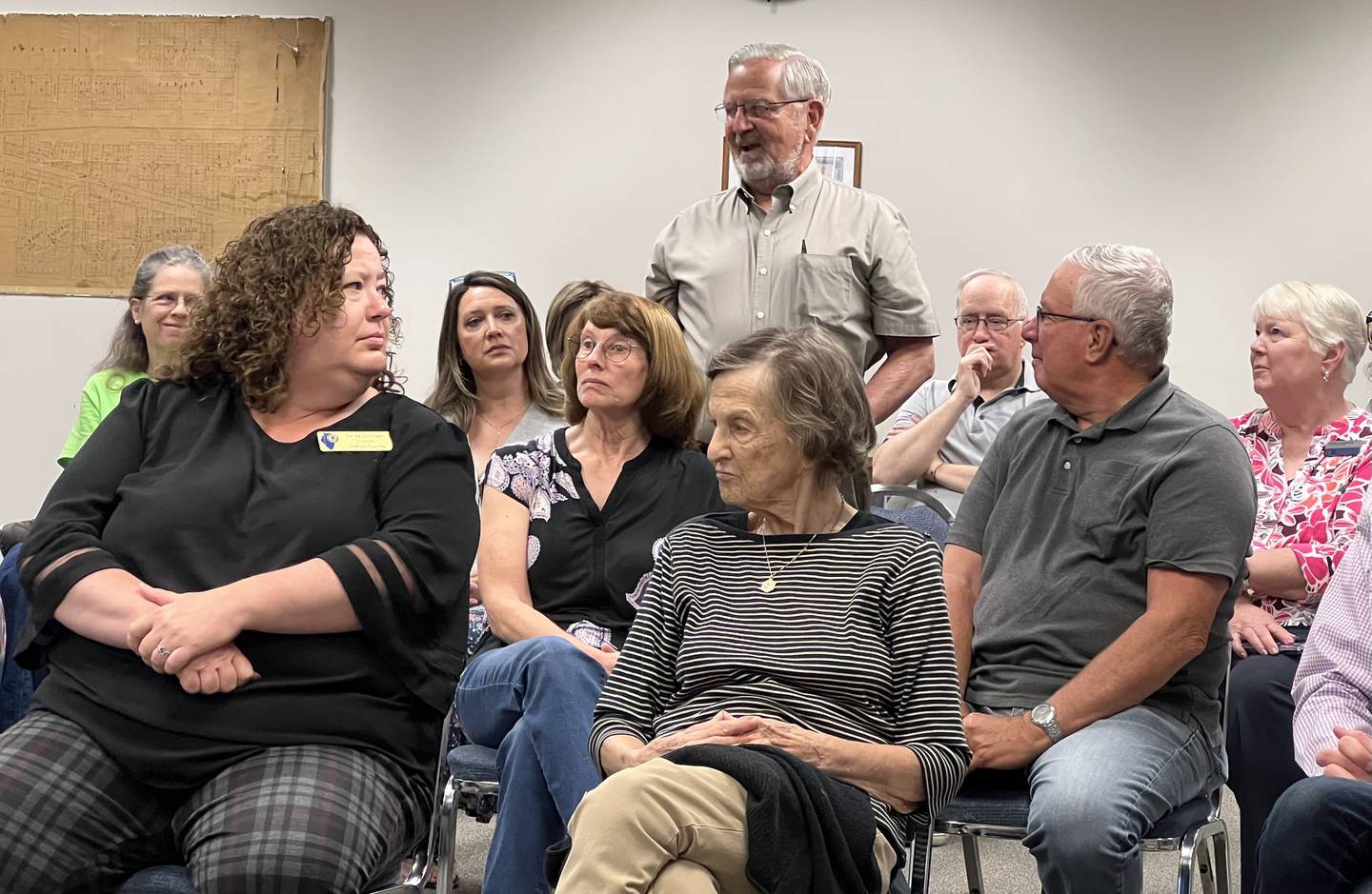 Gordon Jones of the Genoa area stands while talking to GOP House Minority Leader Tony McCombie, R-Savannah and state Rep. Jeff Keicher, R-Sycamore, during a town hall meeting in Genoa on Tuesday, May 30, 2023.