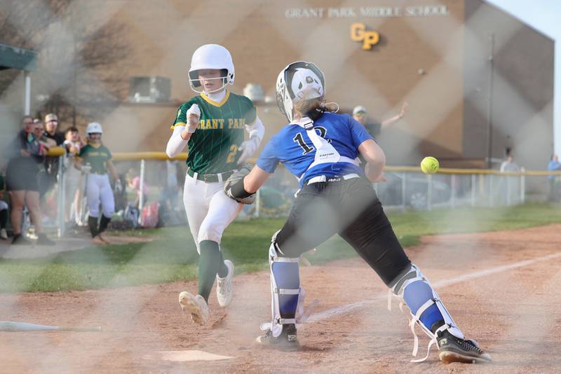 Grant Park's Kaylie Meherg scores a run as Milford/Cissna Park's Evie Niebuhr lost the ball in a fast tag attempt during Grant Park's 12-2 victory in six innings on Wednesday, March 25, 2026.