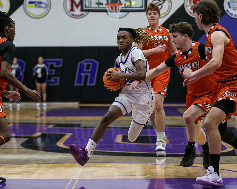 Plano's Taron Mcgowan (24) drives down the lane during their basketball game between Sandwich at Plano. Jan 27, 2025 in Plano.