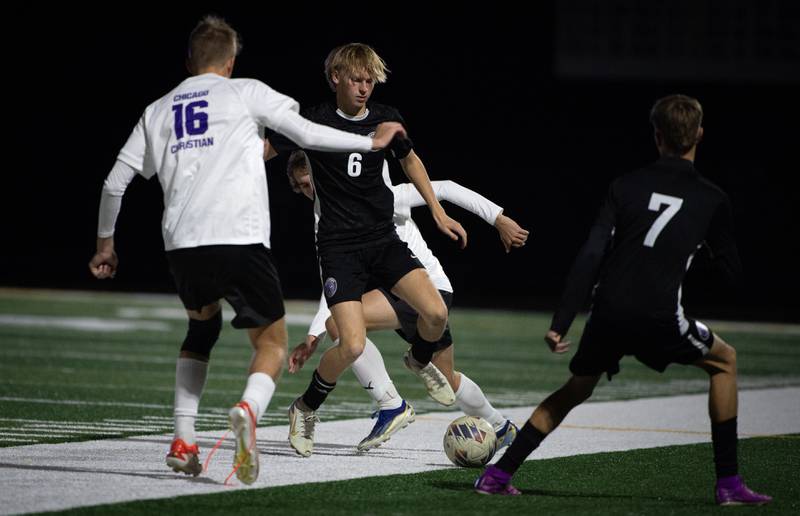 Manteno's Jake Krisko, center, controls the ball in a sectional game against Chicago Christian on Tuesday, October 28, 2025.