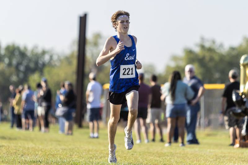 Lincoln-Way East’s Brendan Hanrahan approaches the finish line to win the Locktoberfest three-mile varsity cross country race at Dellwood Park in Lockport on October. 4, 2025.