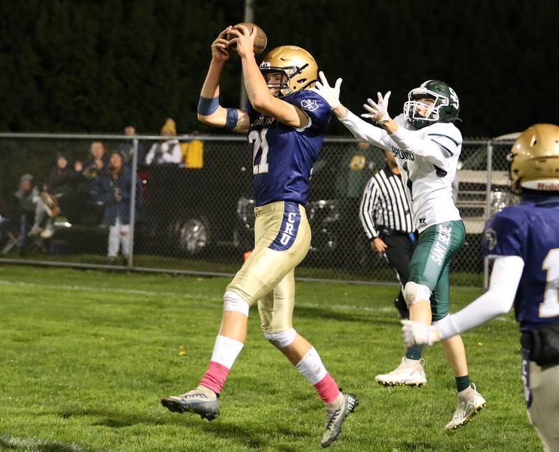 Marquette's Charlie Mullen intercepts a pass intended for St. Bede's Alex Ankiewcz on Friday, Oct. 13, 2023 at Gould Stadium.