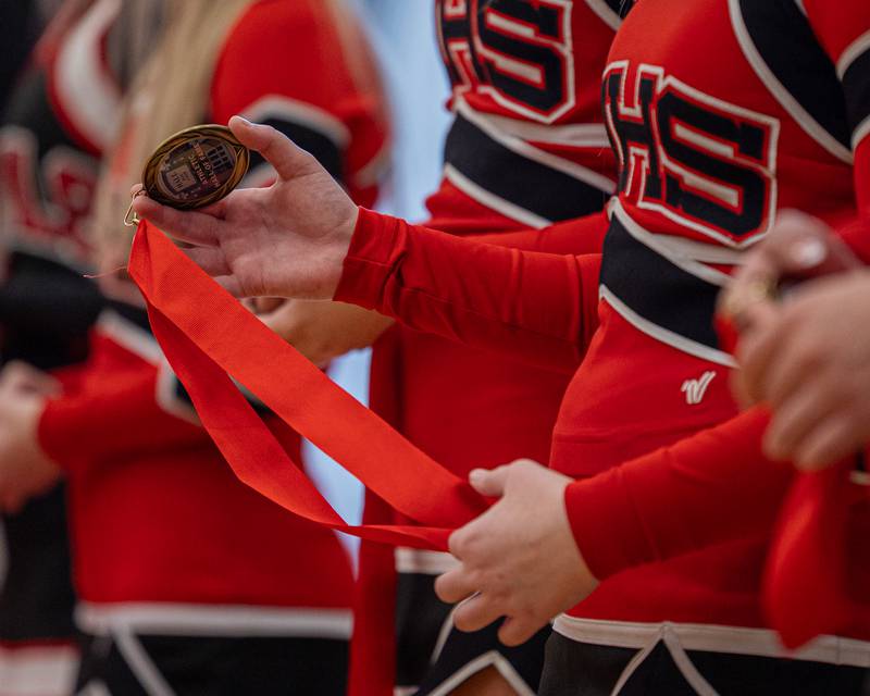 Hall Cheerleader holds medal at the 2026 Hall High School Hall of Fame ceremony on Saturday, January 31, 2026 at Hall High School in Spring Valley.