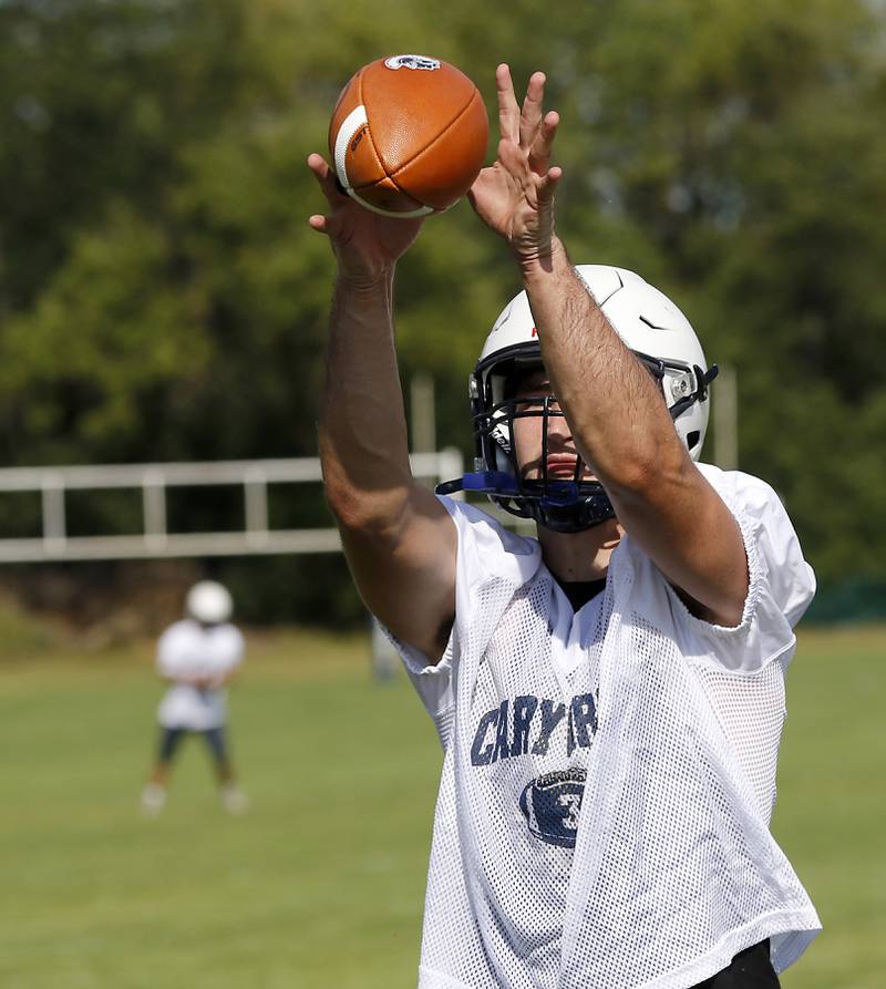 Cary-Grove's Logan Abrams catches the football during Cary-Grove’s first football practice of the upcoming season on Monday, August 11, 2025, at Cary-Grove High School.